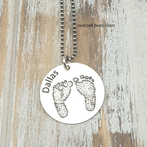 Etched foot print necklace