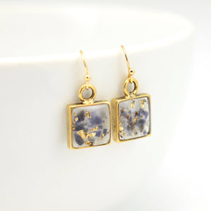 gold earrings with crushed iolite and gold leaf in resin