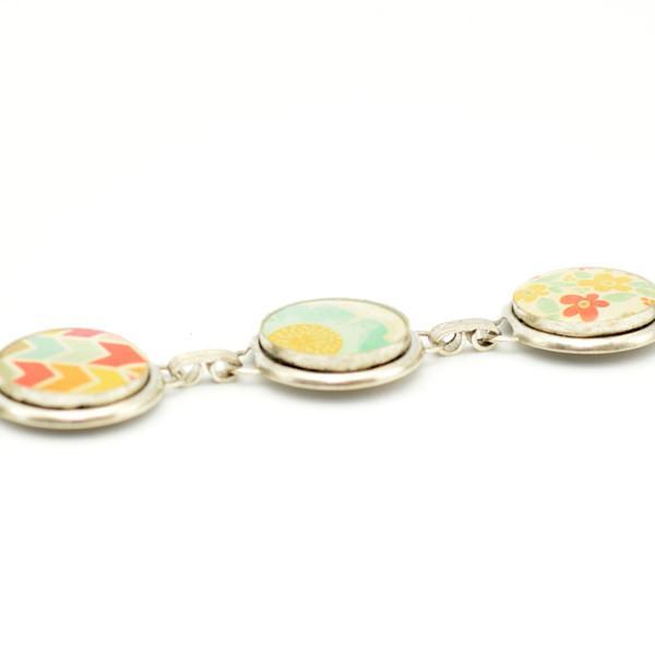 Closeup whimsical silver link bracelet