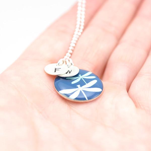 Personalized dragonfly necklace in hand