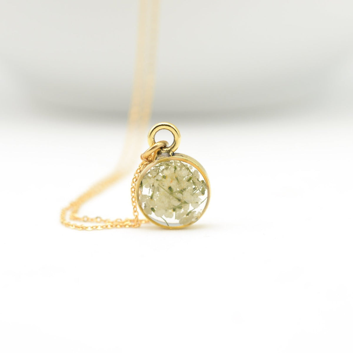Dainty gold blossoms pendant