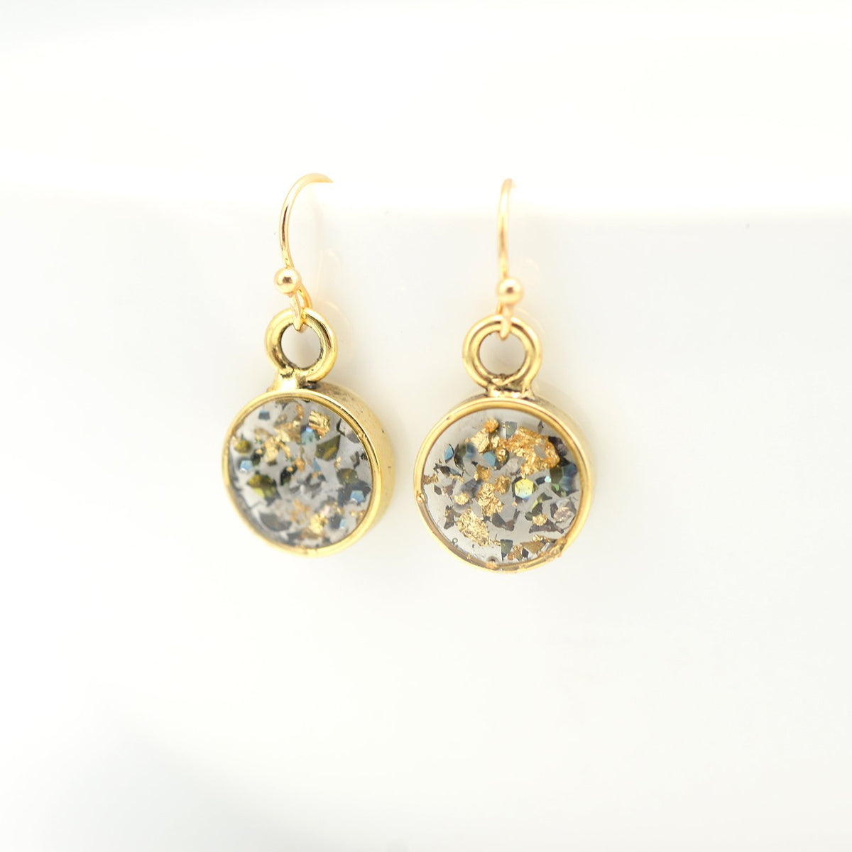 gold round earrings with crushed abalone shell