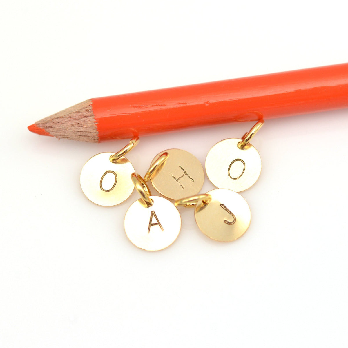 Gold stamped initial charm