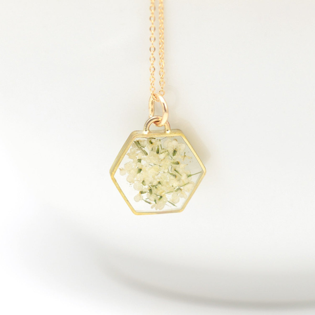 Large floral hexagon necklace in gold