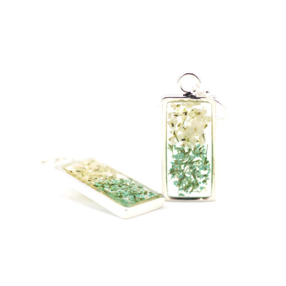 green and white floral earrings